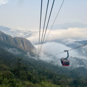 cable car over sapa mountains fog and rice fields