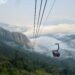 cable car over sapa mountains fog and rice fields