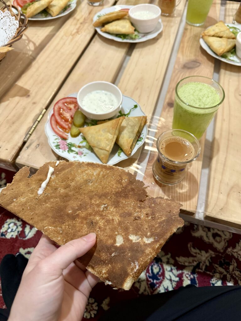 samosas, flat Rogag bread with cheese, Karak tea, Limonana