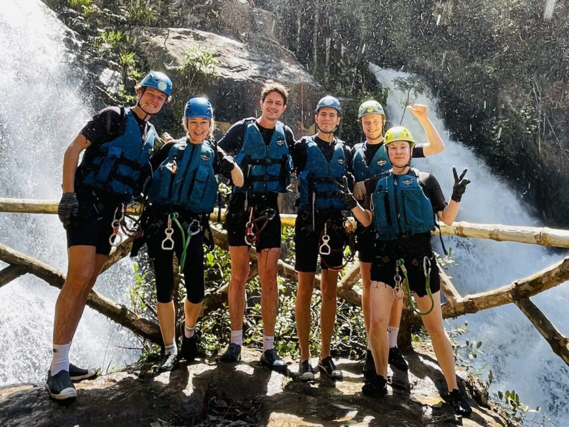 A six people group of two women and four men around 30 going Canyoning in Da Lat - Vietnam